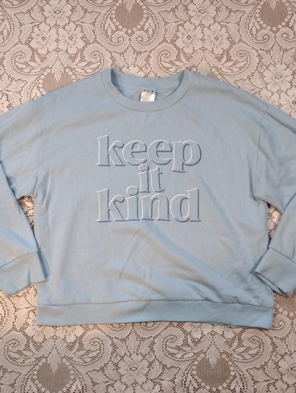 baby blue crew neck sweatshirt with embroidered lettering